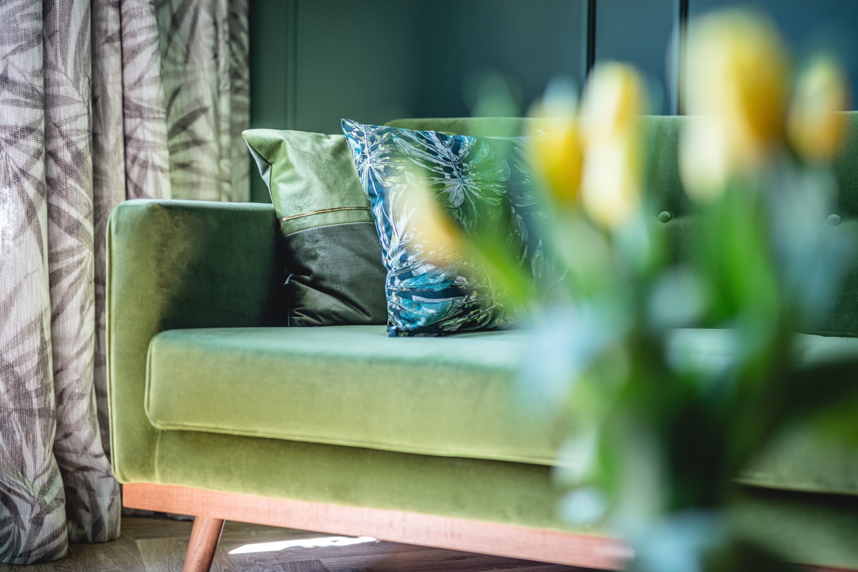 Green Sofa in Elegant Apartment. Home Staging